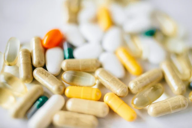 Close-up of assorted capsules and supplement pills