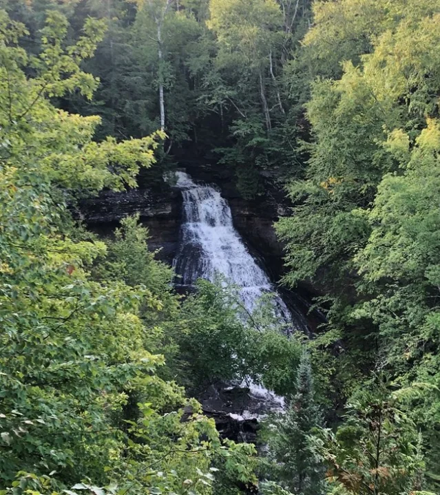 Chapel Falls — 60-foot waterfall cascading through green forest at Pictured Rocks National Lakeshore