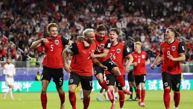 Austria players celebrate against Jordan