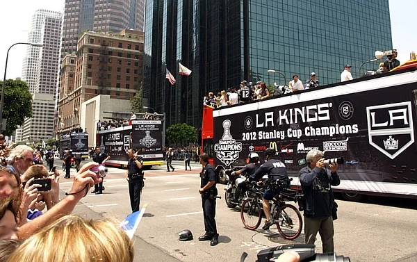 LA Kings players ride double-decker buses down Figueroa Street during the Stanley Cup championship parade on June 14, 2012
