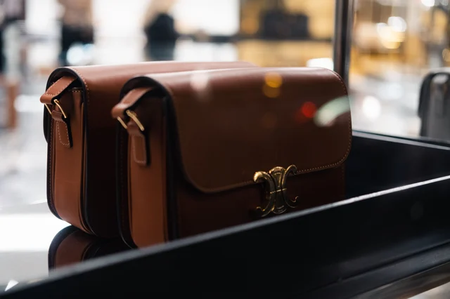 Stylish brown leather handbags showcased indoors with soft lighting