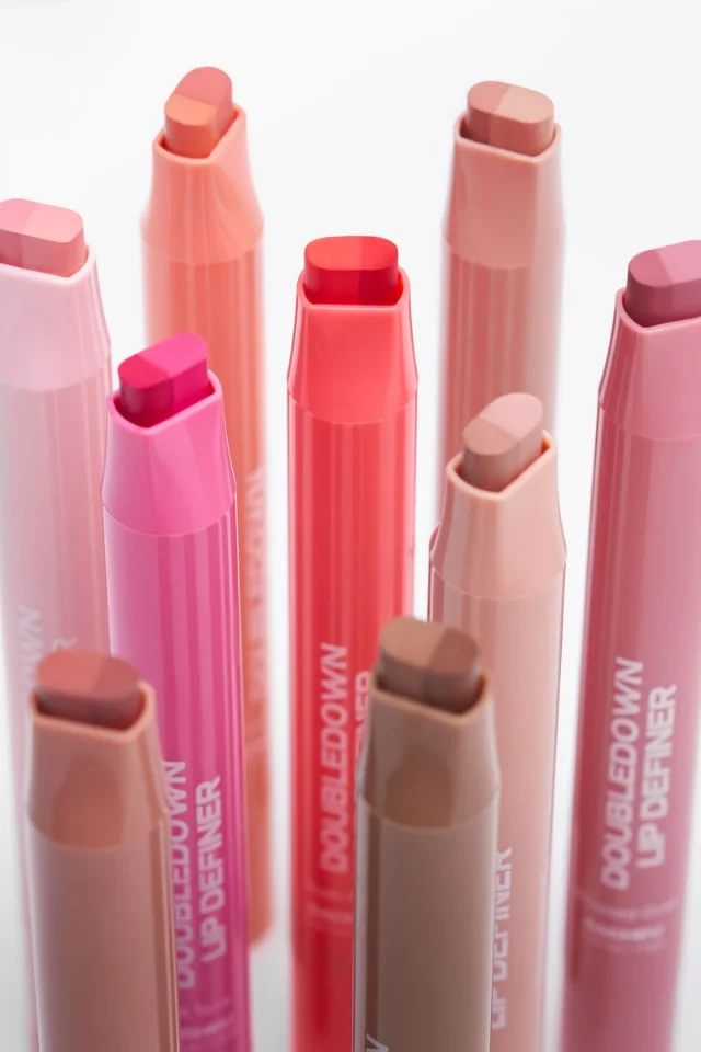 SACHEU DoubleDown Lip Definer — group product shot showing all 9 shades, dual-ended sticks with liner and balm