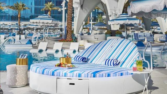 Fontainebleau Las Vegas pool area with cabanas and palm trees