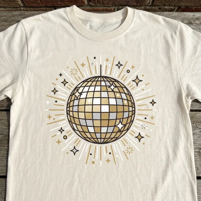 AI-generated concept: Millennium Disco t-shirt — golden disco ball with starburst on a cream tee