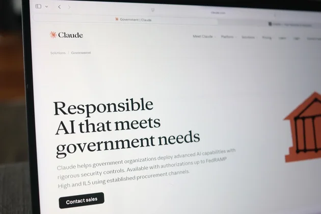 Claude Government page on laptop screen showing "Responsible AI that meets government needs" — photographed during the export control impasse
