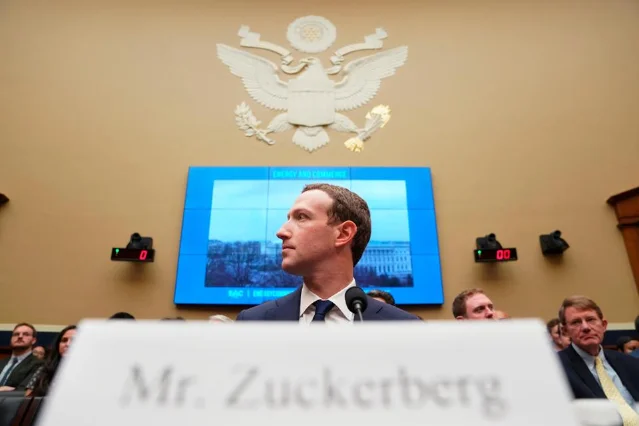 Mark Zuckerberg seated before Congress at his nameplate, April 2018