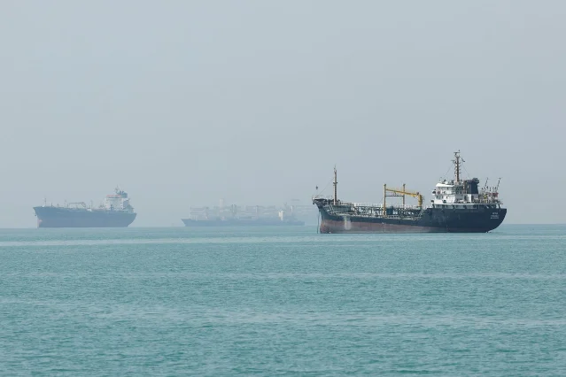 Vessels anchored in the Strait of Hormuz near Khasab, Oman, with shipping congestion visible, May 22, 2026