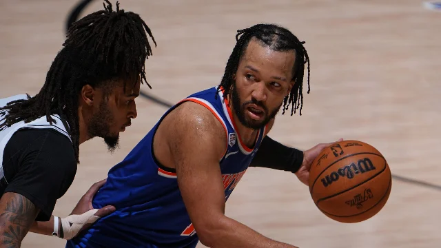 Knicks players celebrate their 2026 NBA championship on the court in San Antonio
