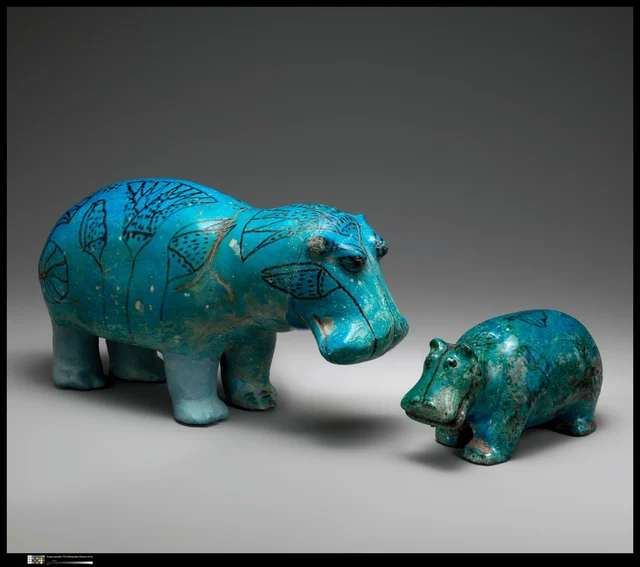 William (left, 20 cm, Dynasty 12) beside a small companion hippo from the Met collection
