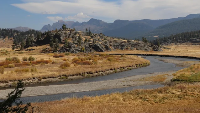 Slough Creek meanders past a rocky outcropping along the trail in Yellowstone's Northeast region