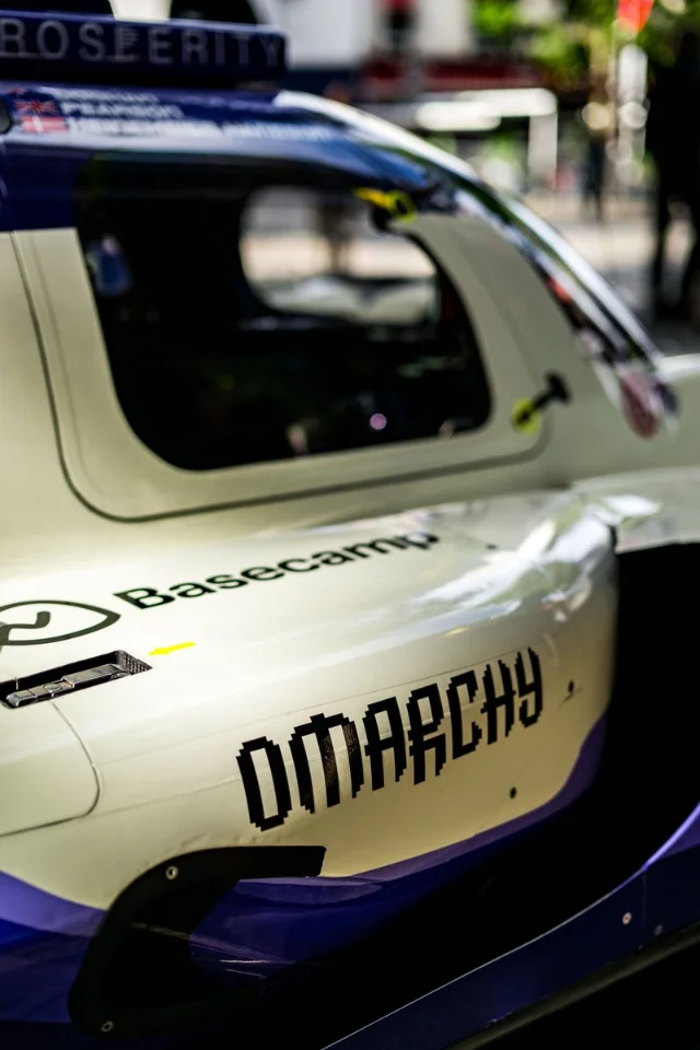 Nielsen Racing #24 LMP2 race car with Basecamp and Omarchy (pixel font) livery at Le Mans