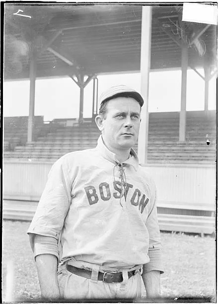 Wiley Piatt in his Boston Beaneaters uniform, photographed near the grandstand at South End Grounds, circa 1903