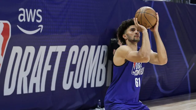 A draft prospect shoots during NBA Draft Combine work