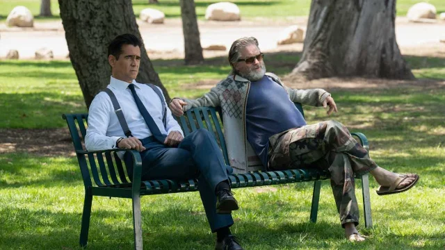 Colin Farrell as John Sugar in Sugar Season 2 — sitting on a park bench in contemplative pose, modern city background