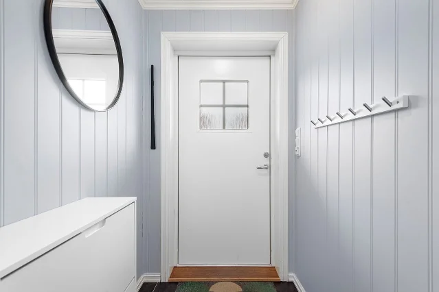A tidy home hallway with room for entryway storage