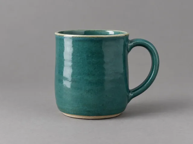 The same studio setup and camera, the mug's color written as a hex code bound to the mug