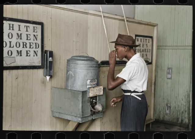 Simulated AI colorization of Russell Lee's segregated water-cooler photograph.