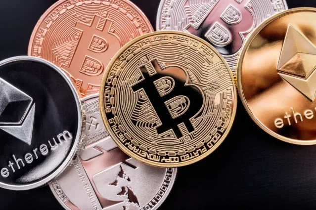 BTC and ETH commemorative coins on black background