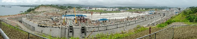 Panoramic view of the Agua Clara lock complex under construction, 2013, with concrete walls reaching final height and cranes visible throughout