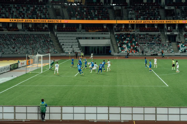 Generic football match in a modern stadium