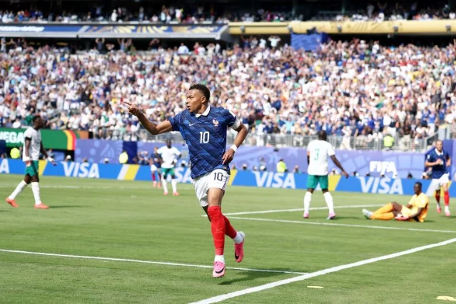 Kylian Mbappe celebrating after scoring France's opening goal against Senegal