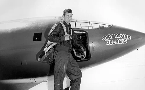Chuck Yeager stands beside the Bell X-1 "Glamorous Glennis" at Muroc Army Air Base, 1947