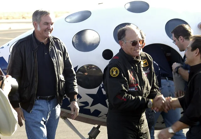 Burt Rutan (left) and pilot Mike Melvill after the June 21 flight, SpaceShipOne behind them at Mojave